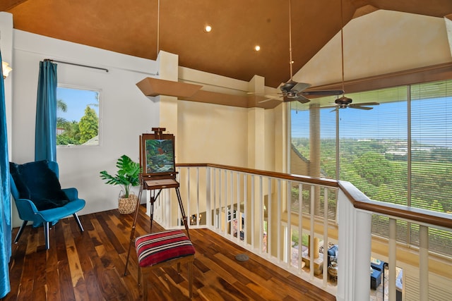 sitting room featuring ceiling fan, hardwood / wood-style flooring, and lofted ceiling