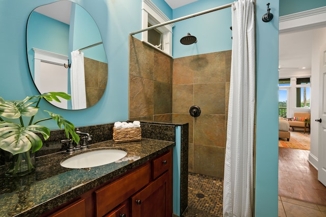 bathroom featuring vanity, walk in shower, and hardwood / wood-style flooring