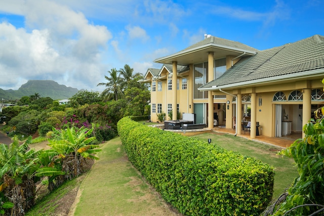 view of yard with a mountain view and a patio area