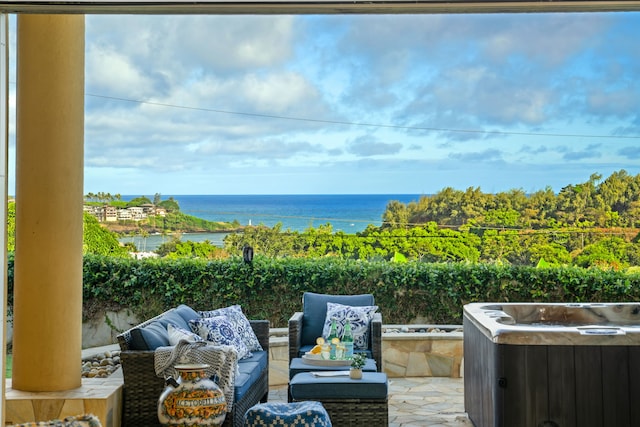 view of patio / terrace featuring outdoor lounge area and a water view