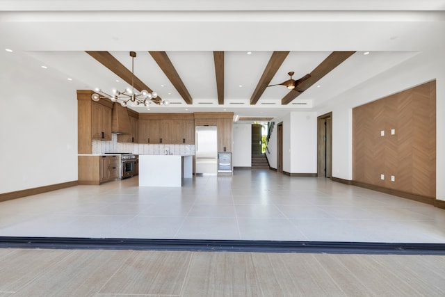 unfurnished living room featuring beamed ceiling, ceiling fan with notable chandelier, and light tile patterned floors