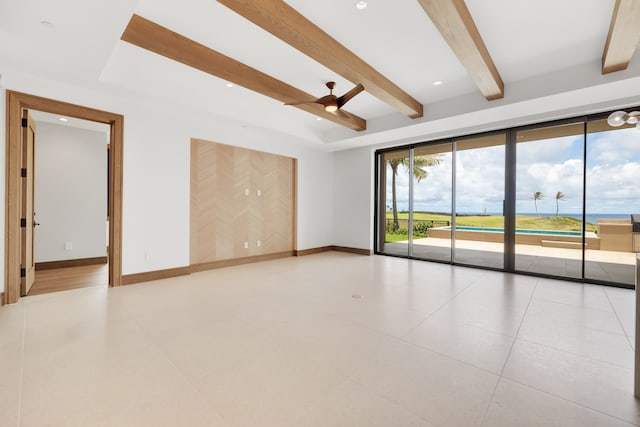 unfurnished room featuring ceiling fan, light tile patterned flooring, and beamed ceiling