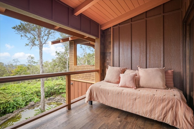 interior space with vaulted ceiling with beams and wood ceiling