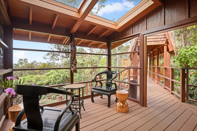 interior space featuring expansive windows and hardwood / wood-style flooring