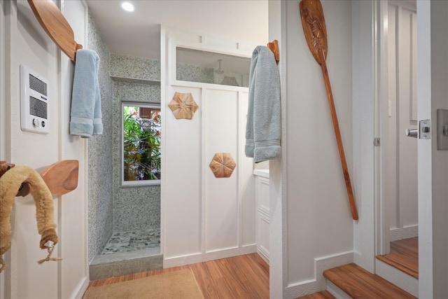 bathroom with hardwood / wood-style floors