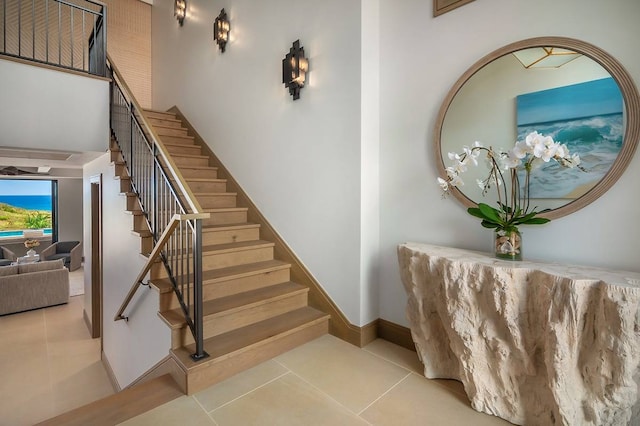 staircase with tile patterned floors