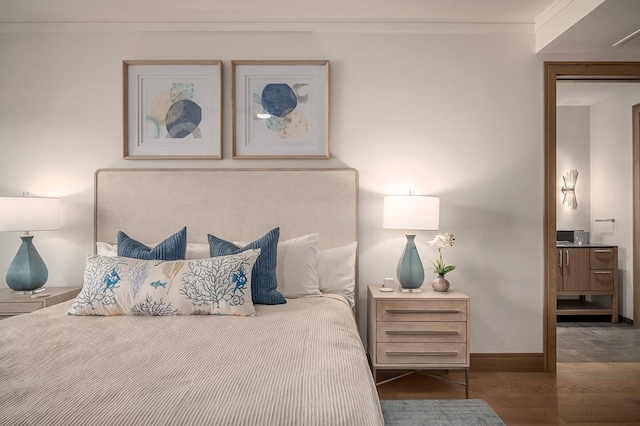 bedroom with ornamental molding and dark wood-type flooring