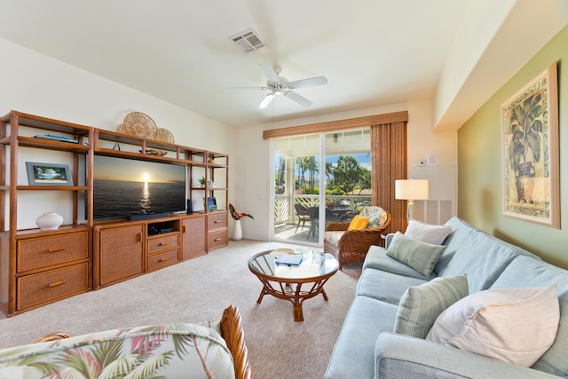 living room with carpet and ceiling fan