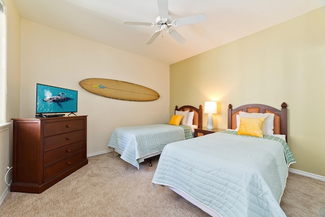 bedroom featuring light colored carpet and ceiling fan