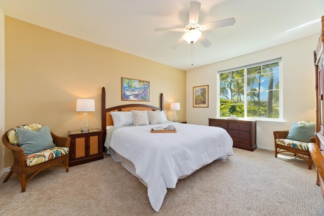 bedroom with light colored carpet and ceiling fan