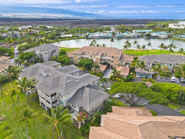 aerial view featuring a water and mountain view