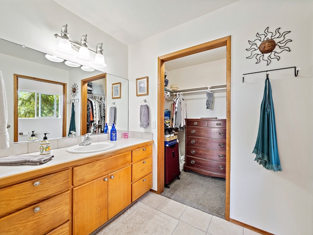 bathroom with tile patterned floors and vanity