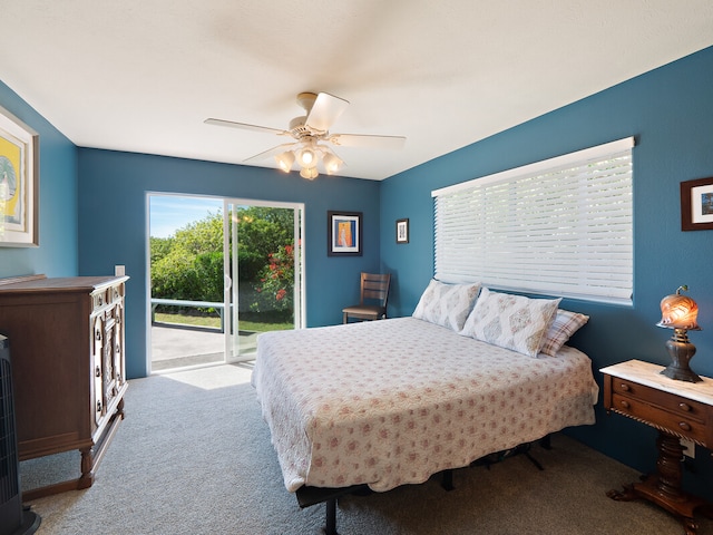 carpeted bedroom with ceiling fan and access to exterior