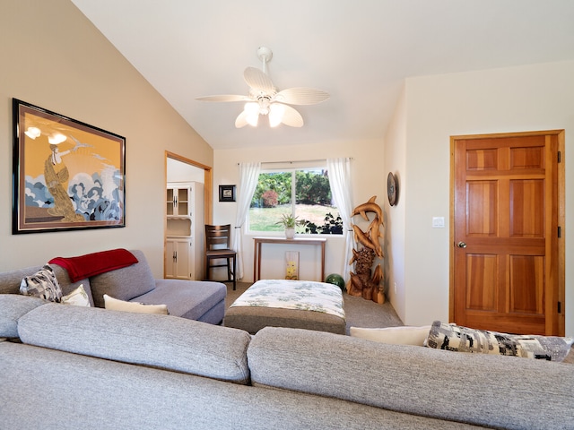 carpeted living room with vaulted ceiling and ceiling fan