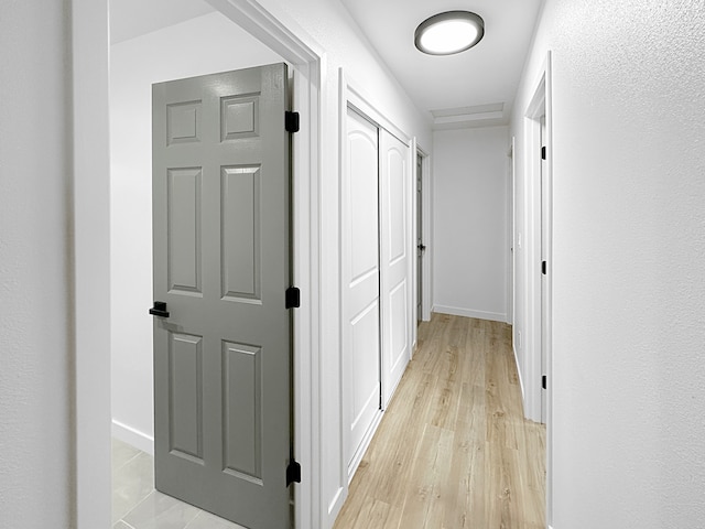 hall with light wood-type flooring