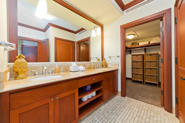 bathroom featuring tile patterned flooring, dual bowl vanity, and ornamental molding