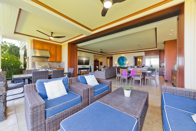 exterior space featuring ceiling fan, grilling area, an outdoor living space, and exterior kitchen