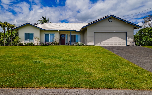 ranch-style house with a front yard and a garage