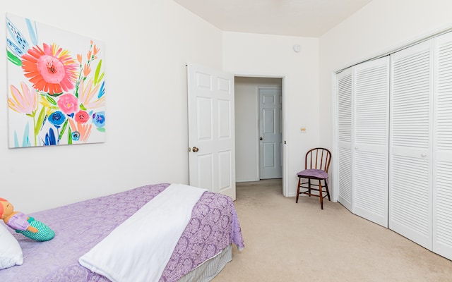 carpeted bedroom featuring a closet