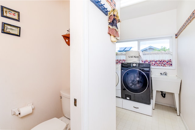 laundry area with washing machine and dryer