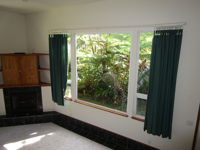 unfurnished living room featuring a fireplace