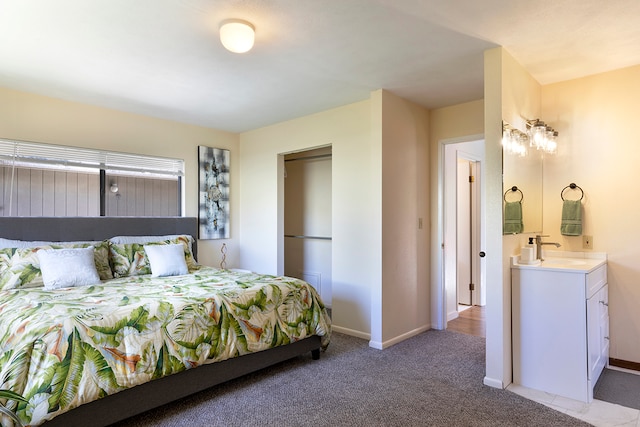 bedroom featuring sink and carpet