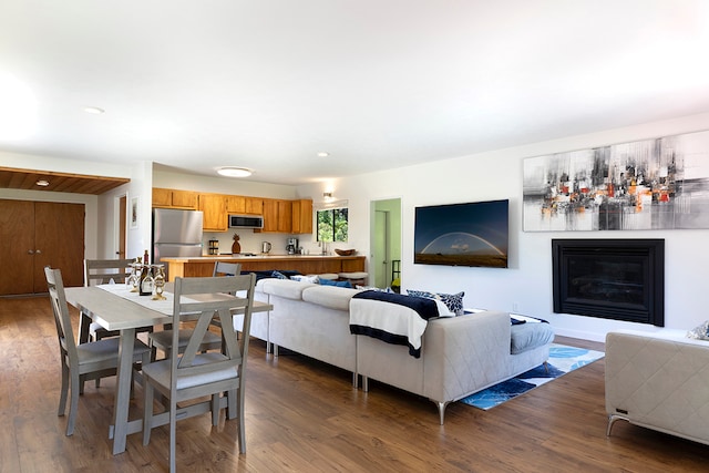 living room with dark hardwood / wood-style flooring