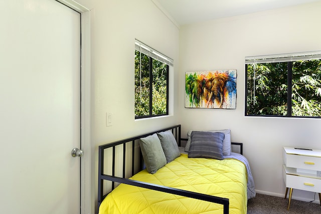 bedroom featuring light carpet and ornamental molding