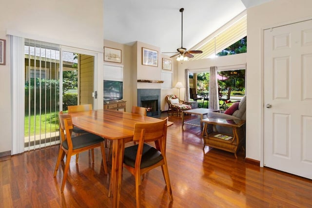 dining room featuring ceiling fan, hardwood / wood-style flooring, plenty of natural light, and high vaulted ceiling