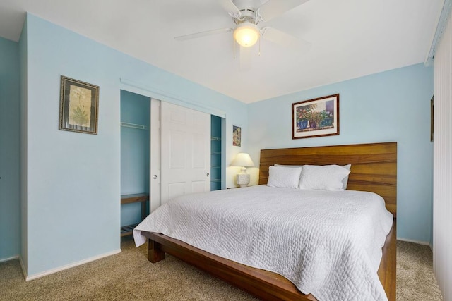 carpeted bedroom featuring a closet and ceiling fan