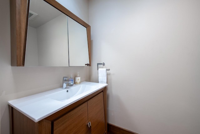 bathroom featuring visible vents and vanity