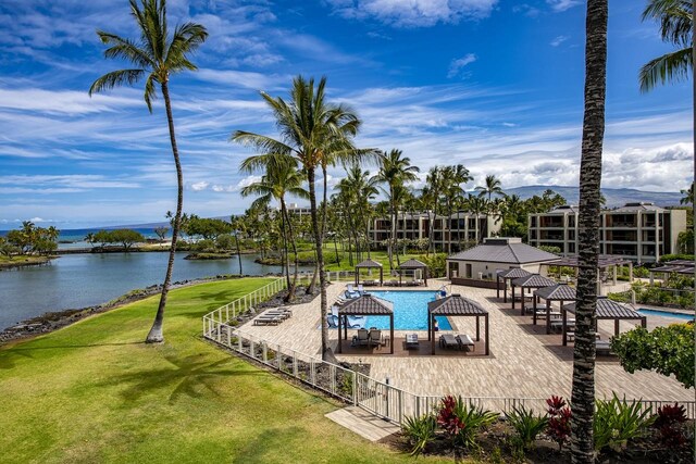 view of pool featuring a gazebo, a yard, and a water view