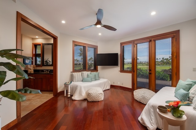 living room with hardwood / wood-style flooring and ceiling fan