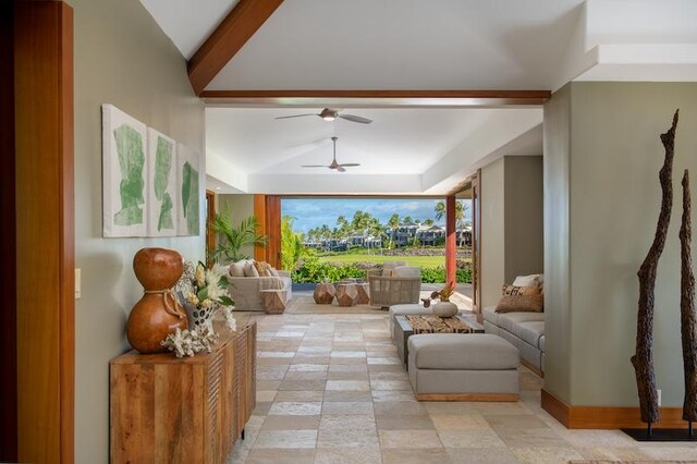 living room with vaulted ceiling, light tile patterned floors, and ceiling fan