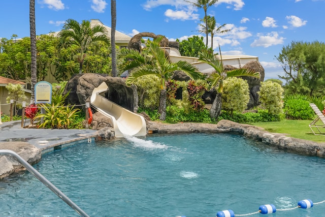 view of pool with a water slide