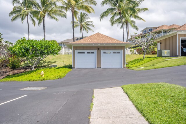 garage with a lawn