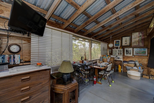 misc room featuring finished concrete floors and vaulted ceiling