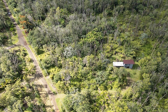 bird's eye view with a wooded view