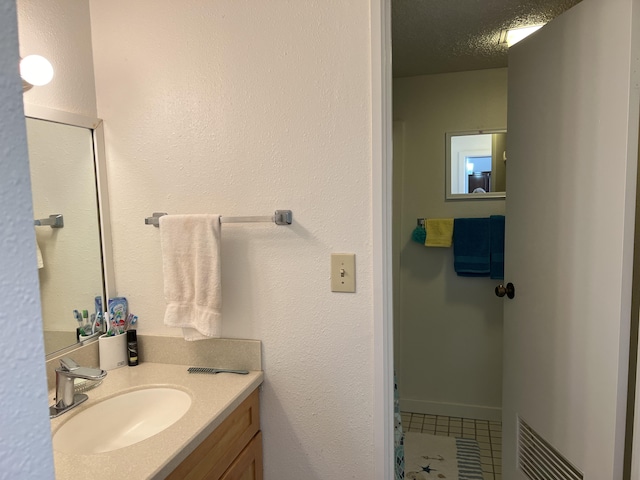 101 Hilo Lagoon Ctr Unit 401, Hilo, HI 96720 - bathroom with tile patterned floors and vanity