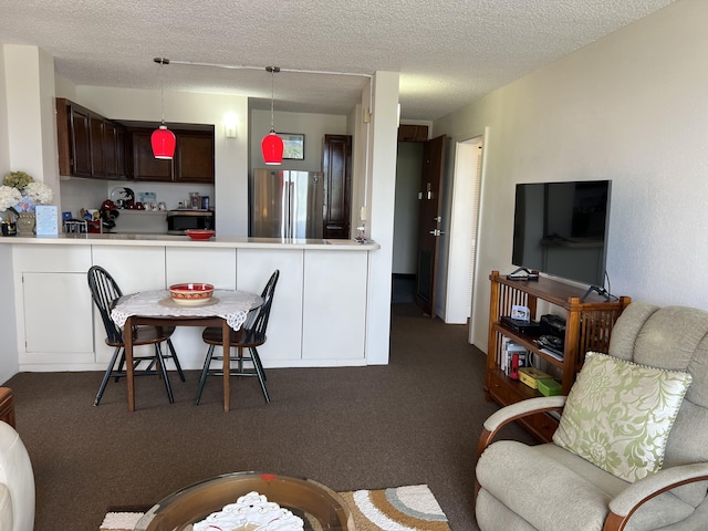 101 Hilo Lagoon Ctr Unit 401, Hilo, HI 96720 - living area with dark carpet and a textured ceiling