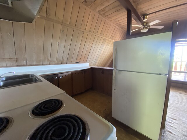 kitchen featuring ceiling fan, wood ceiling, wooden walls, tile patterned floors, and white appliances