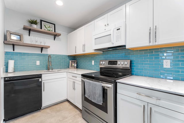 kitchen featuring dishwasher, decorative backsplash, sink, electric range, and white cabinets