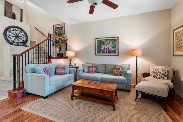 living room featuring ceiling fan and hardwood / wood-style floors