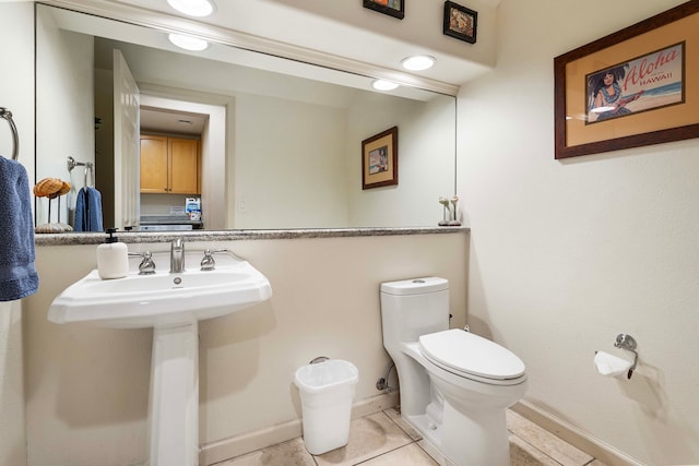 bathroom featuring toilet and tile patterned floors