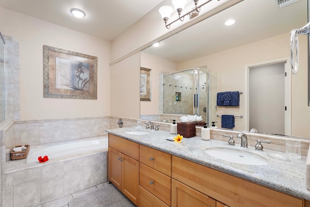 bathroom with tile patterned floors, independent shower and bath, and double vanity