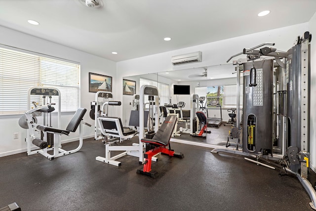 exercise room with a wall mounted air conditioner