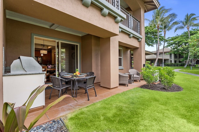 view of patio featuring a balcony