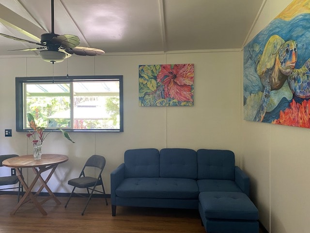 living room with lofted ceiling, ceiling fan, and wood-type flooring