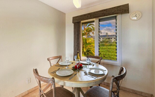 dining room with tile patterned floors