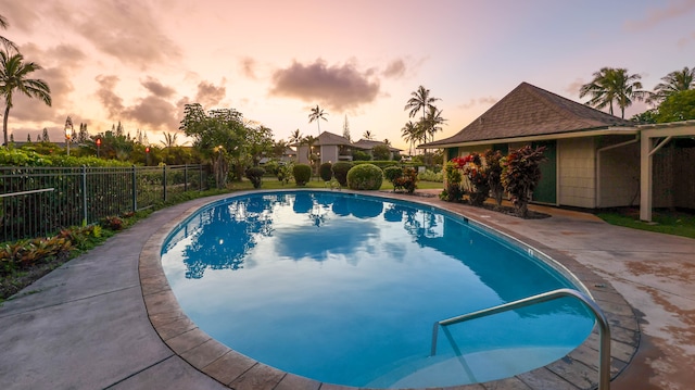 view of pool at dusk